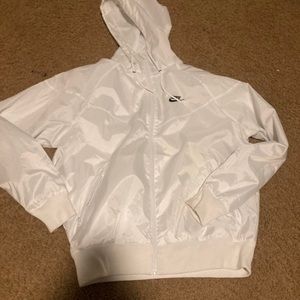 Nike Windrunner size S, but fits like a M